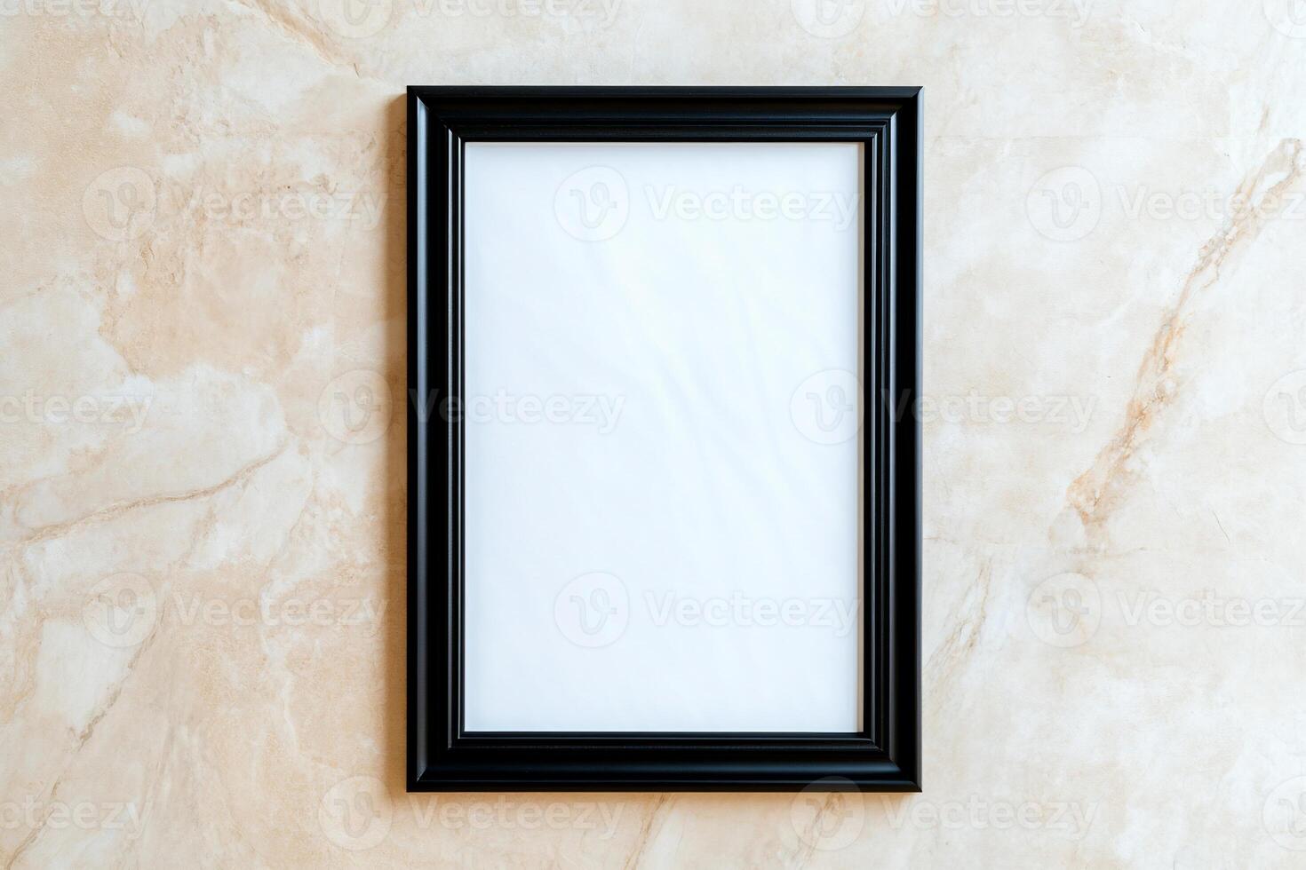 A blank picture frame on a textured surface, ready for artwork. photo