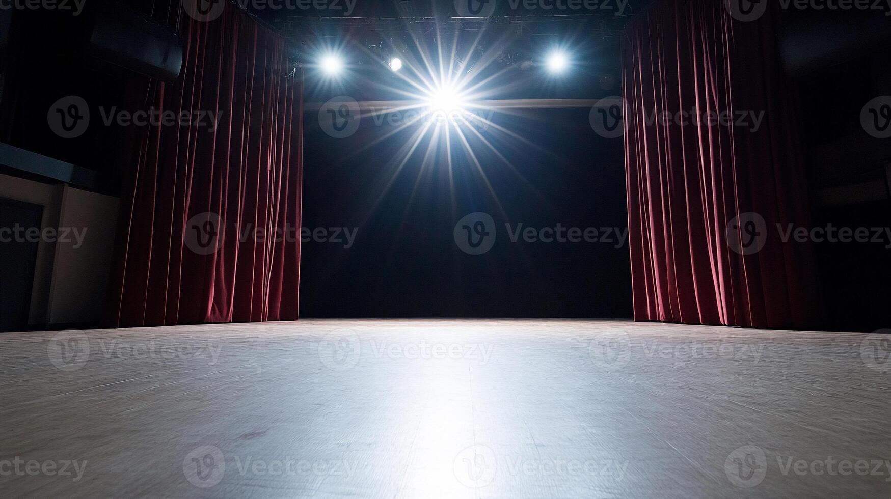 A brightly lit stage with red curtains, ready for a performance. photo