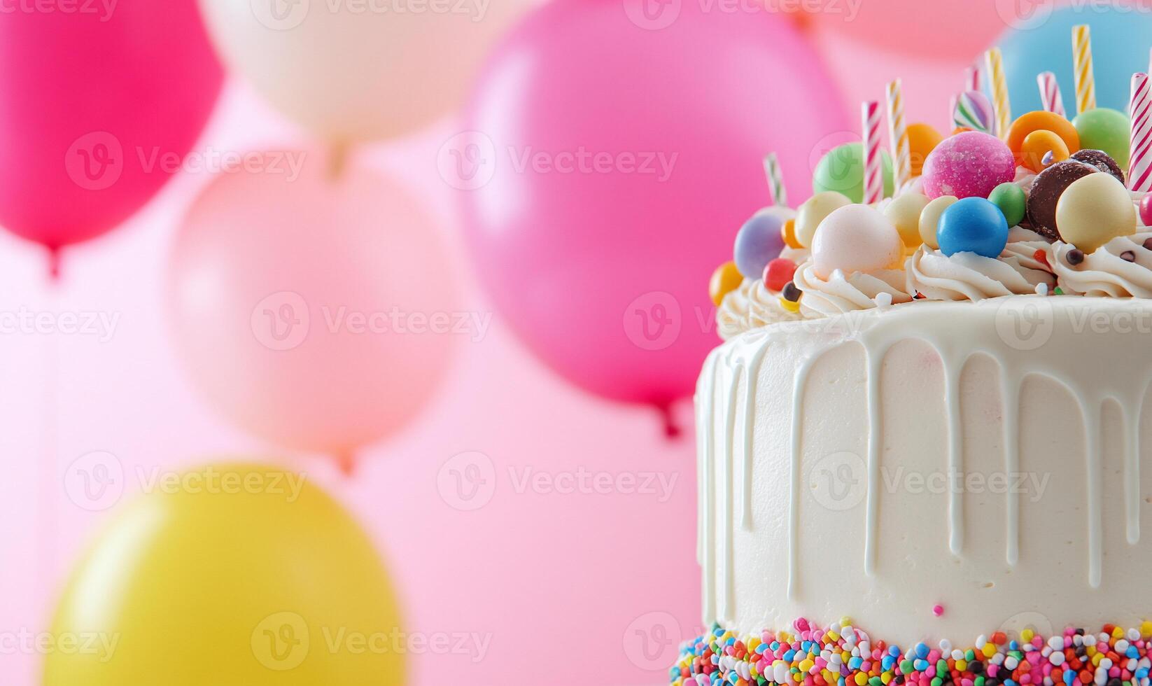 A festive cake adorned with colorful decorations and balloons. photo