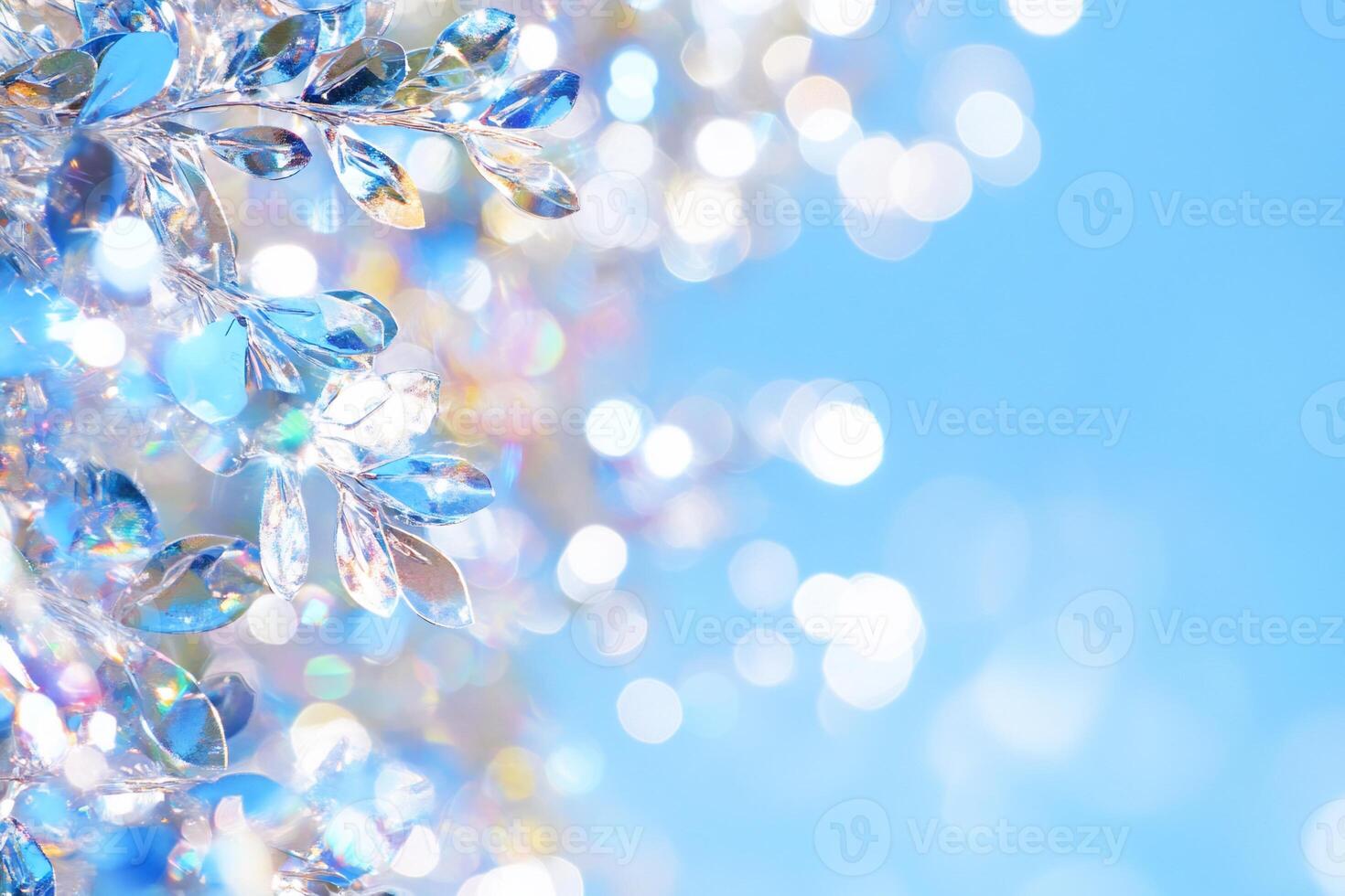 A close-up of shimmering blue and clear crystals against a bright background. photo