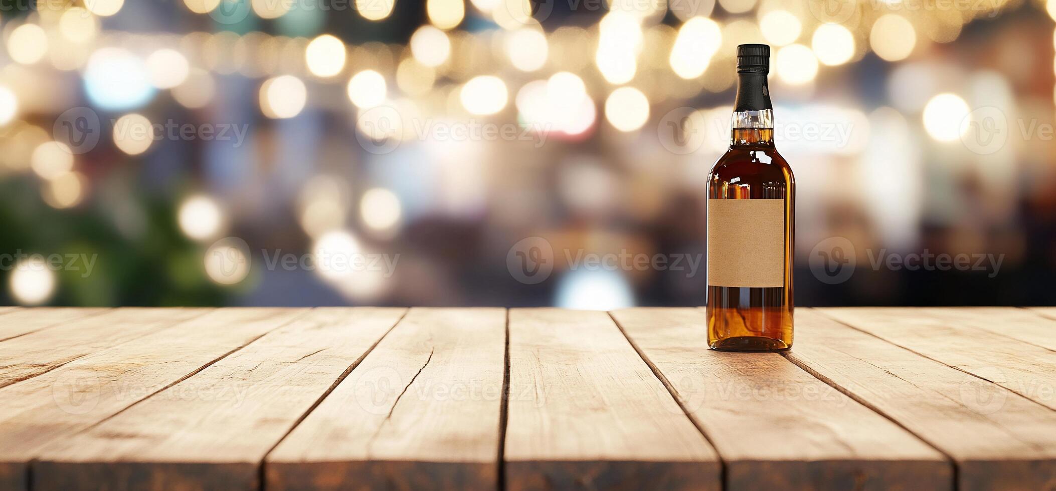 A bottle of liquor on a wooden table with a blurred background. photo
