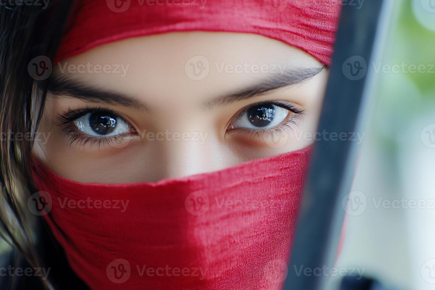 A woman with a red bandana on her face photo