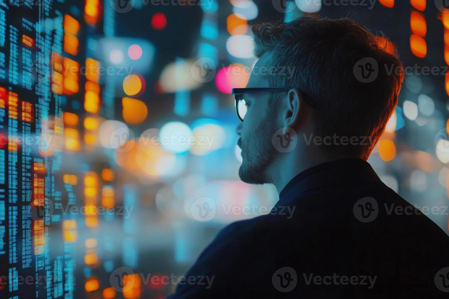 A person observing digital data on a screen, immersed in analysis. photo