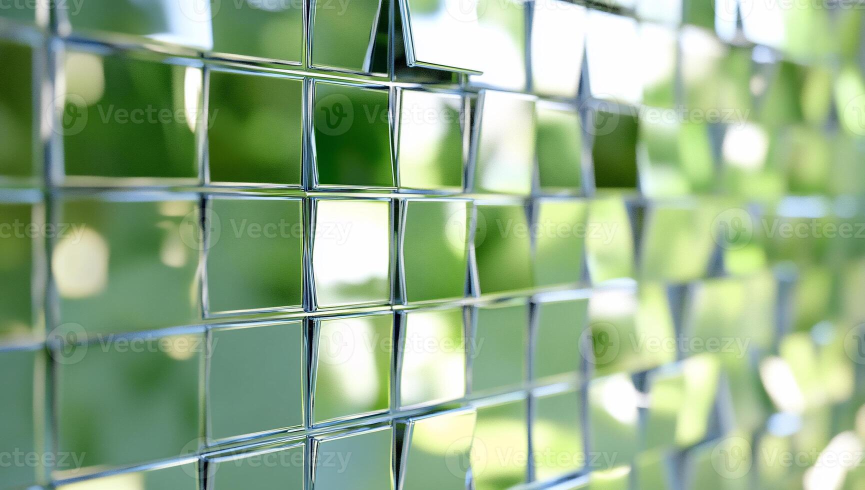 A close-up of a reflective, grid-like surface with blurred greenery. photo