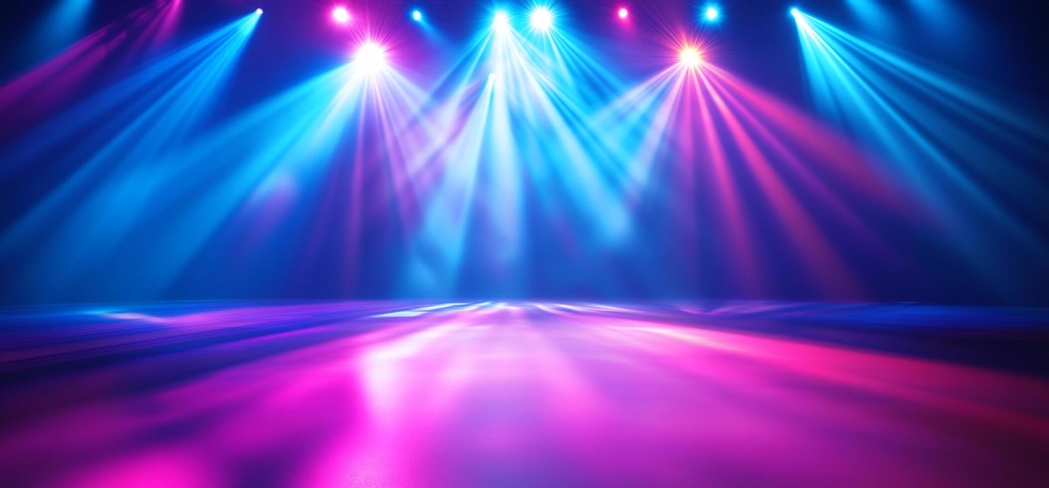 Colorful stage lights illuminate an empty performance space. photo