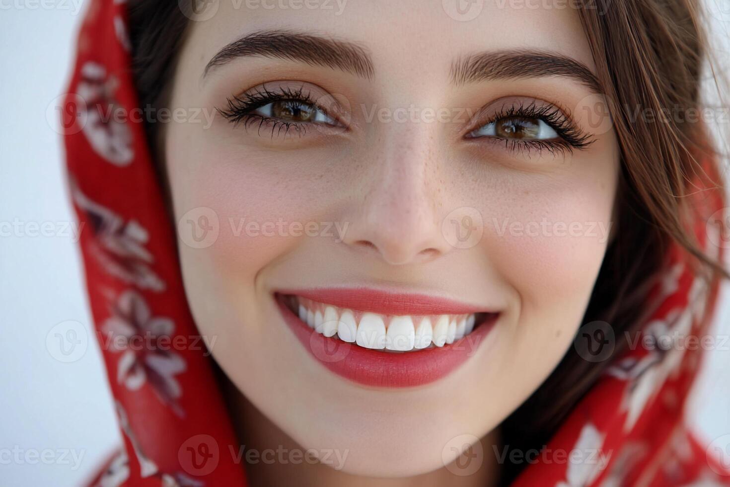 A woman with a red scarf on her head photo