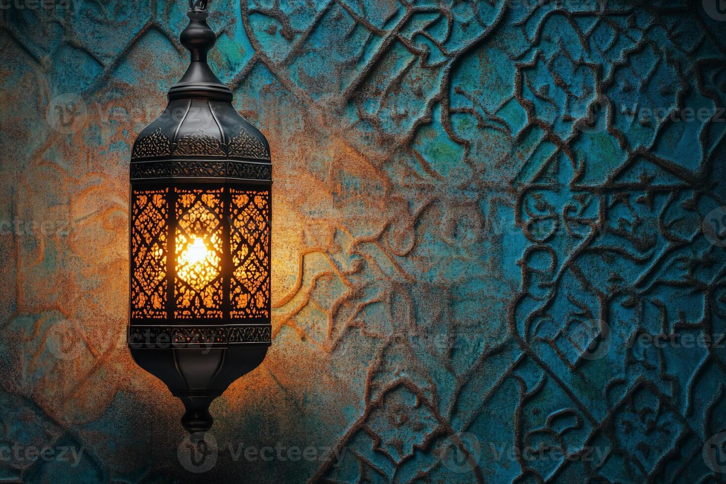 A decorative lantern illuminates an intricately designed wall. photo