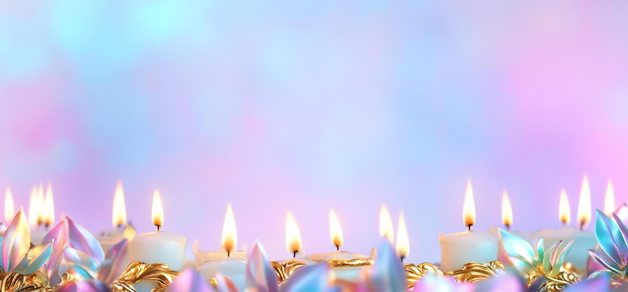 A serene display of lit candles with a colorful, blurred background. photo