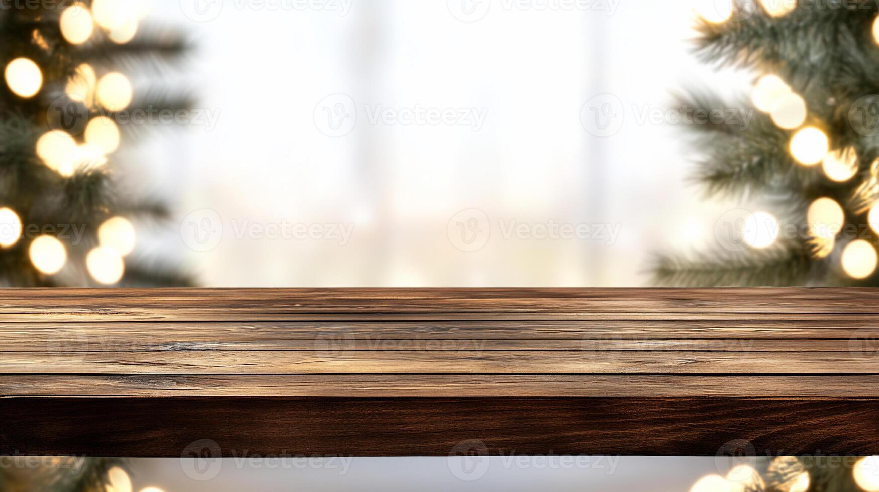 Christmas tree and wooden table in front of blurred background photo