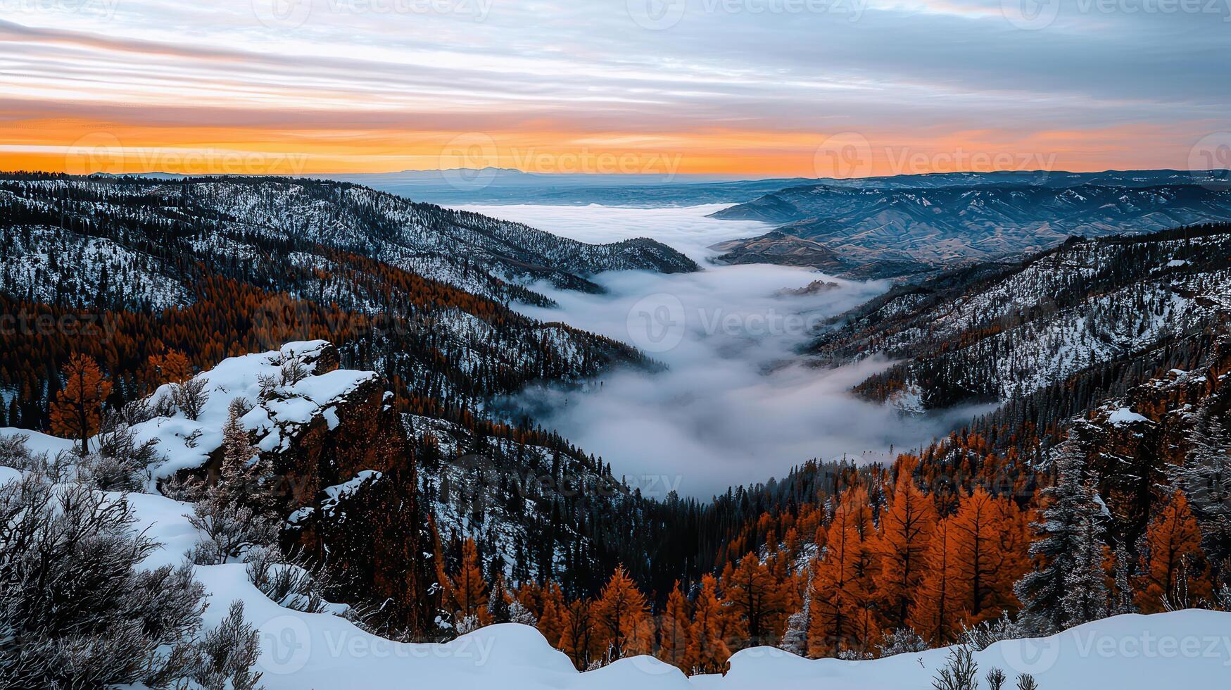 Stunning Sunrise Over Snowy Mountains and Fog Filled Valley Winter Landscape photo