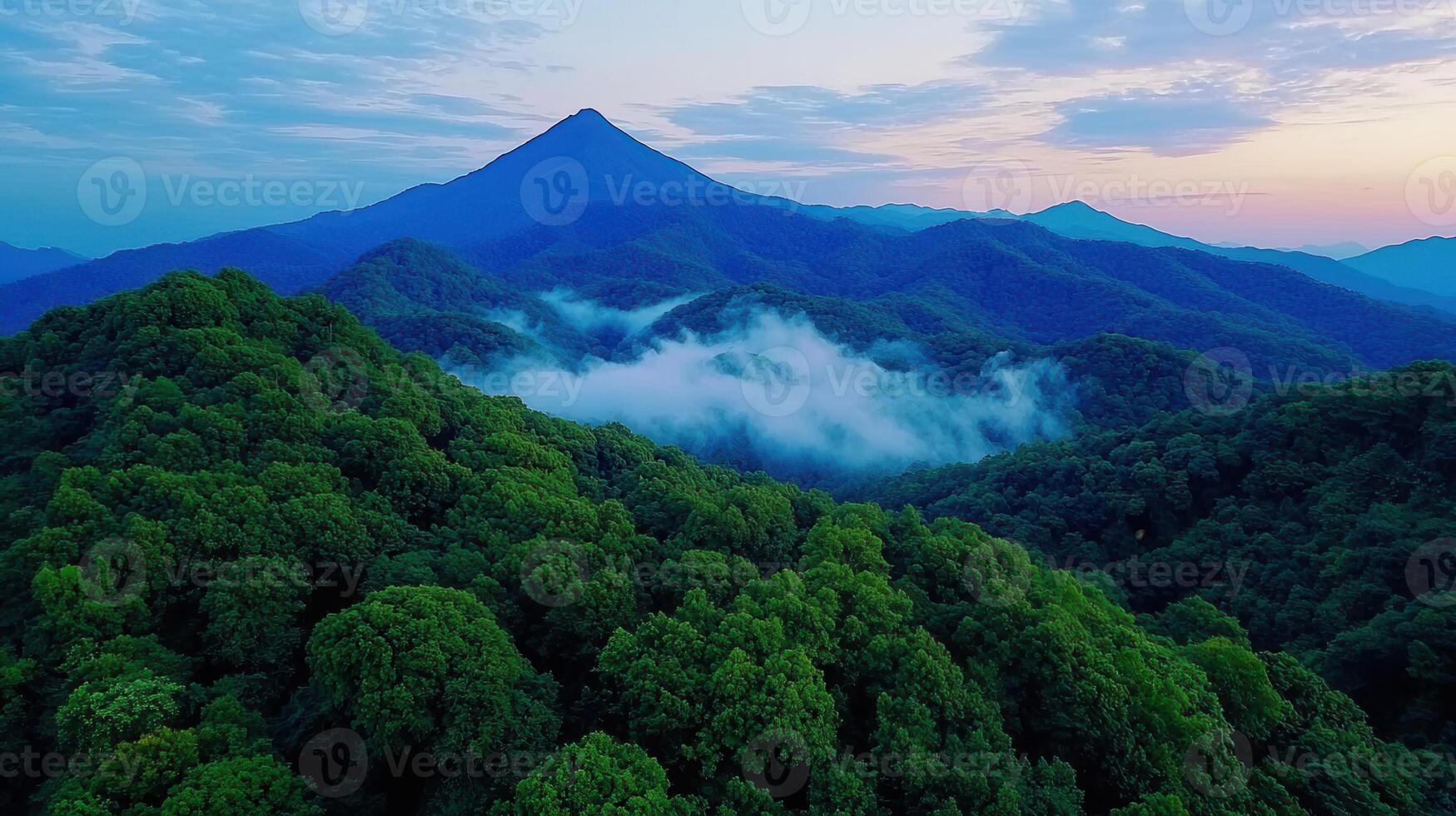 Majestic Mountain Range at Dawn Lush Green Forest Misty Peaks Scenic Vista photo