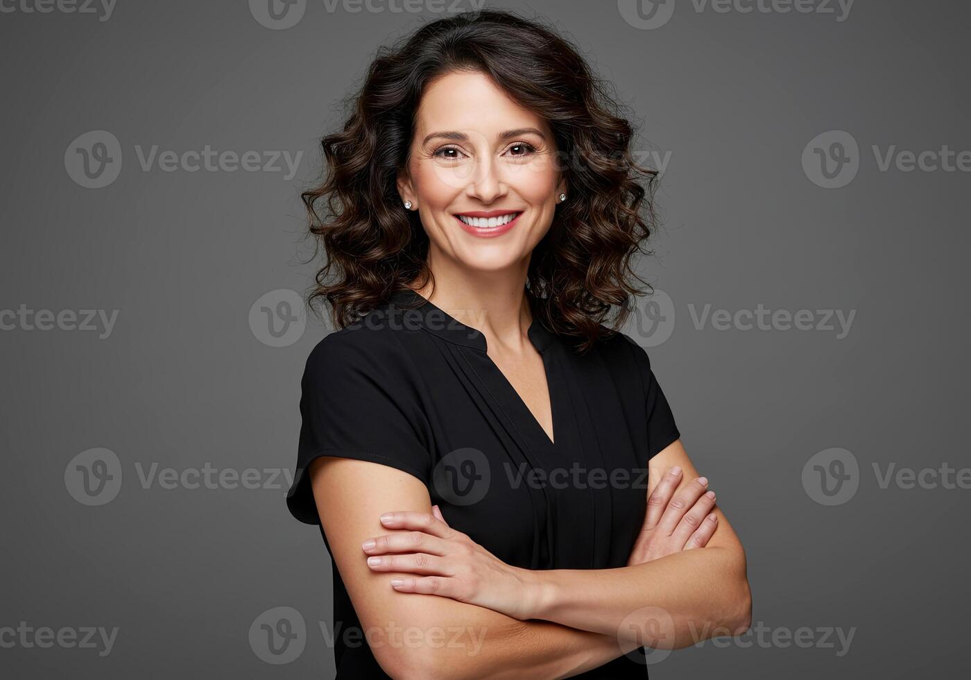 A woman with curly hair and a black top photo