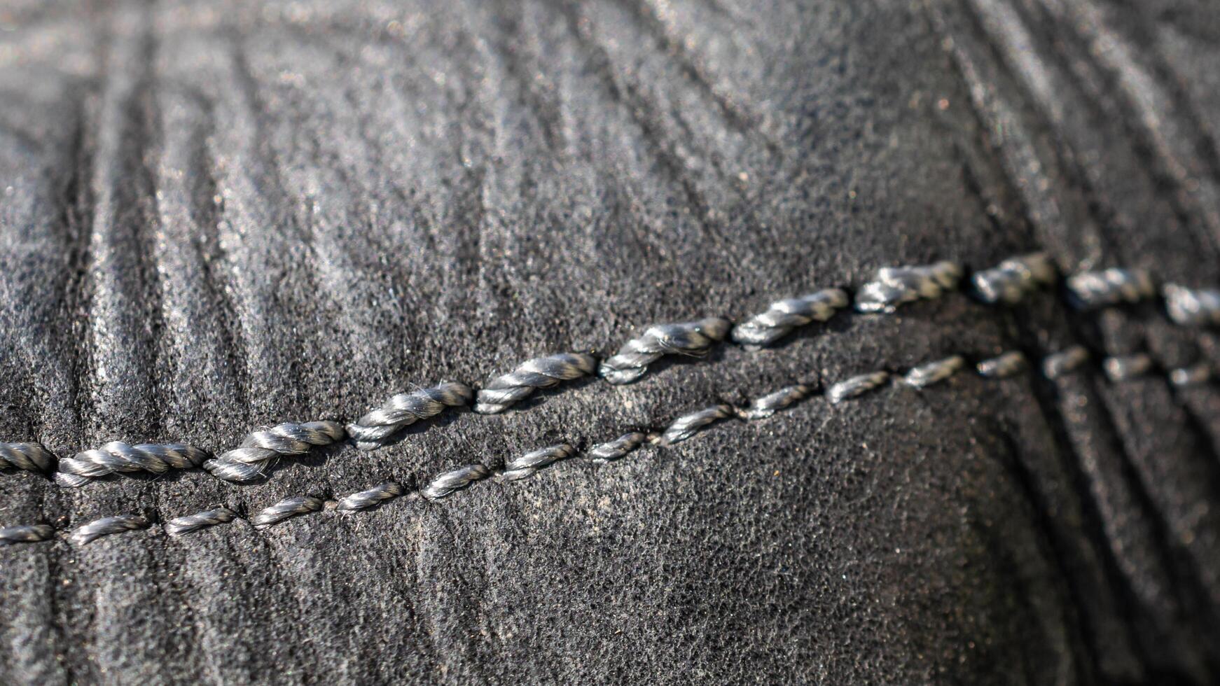 black crinkle leather with light threads photo