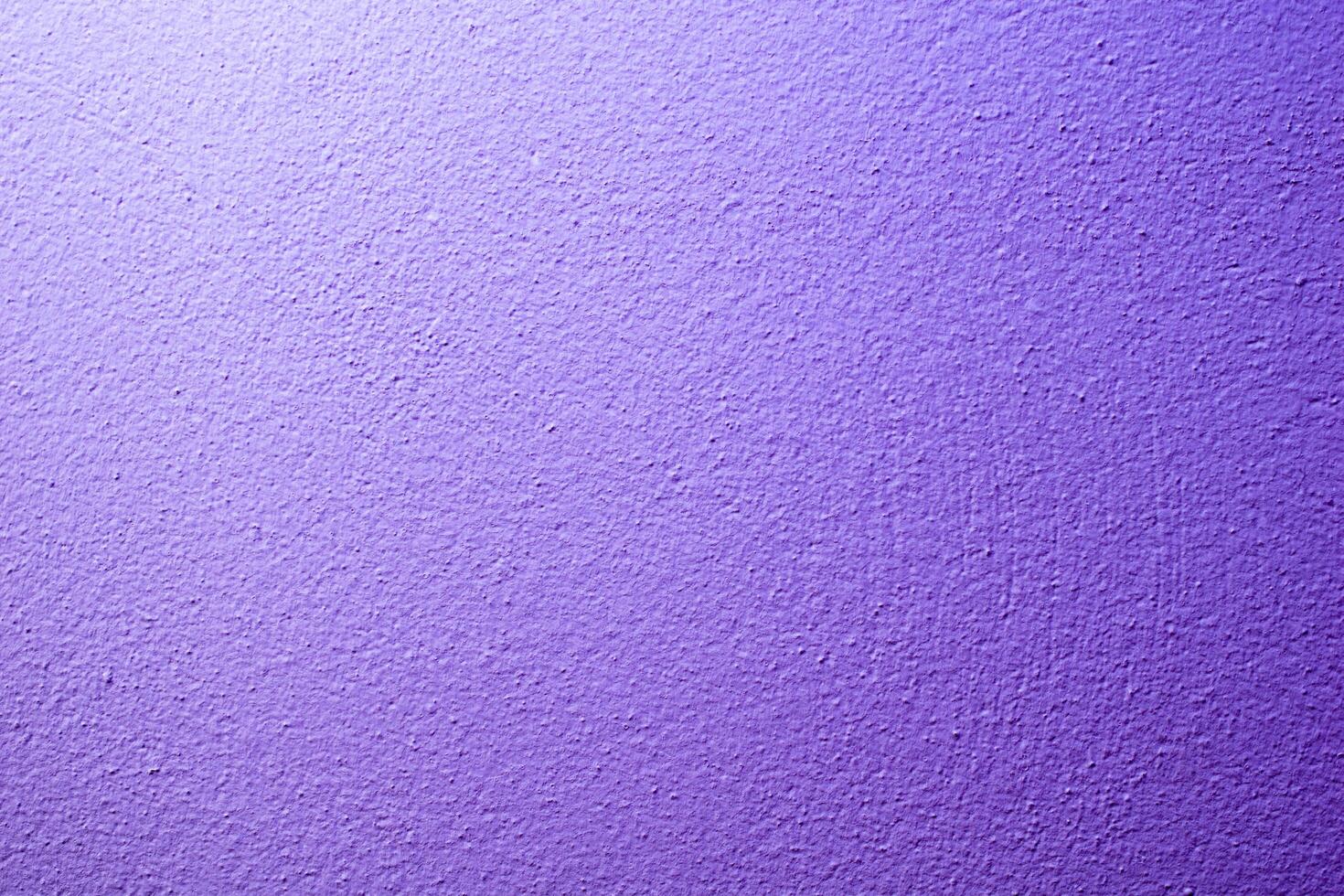 the wall is painted with purple paint with visible details photo