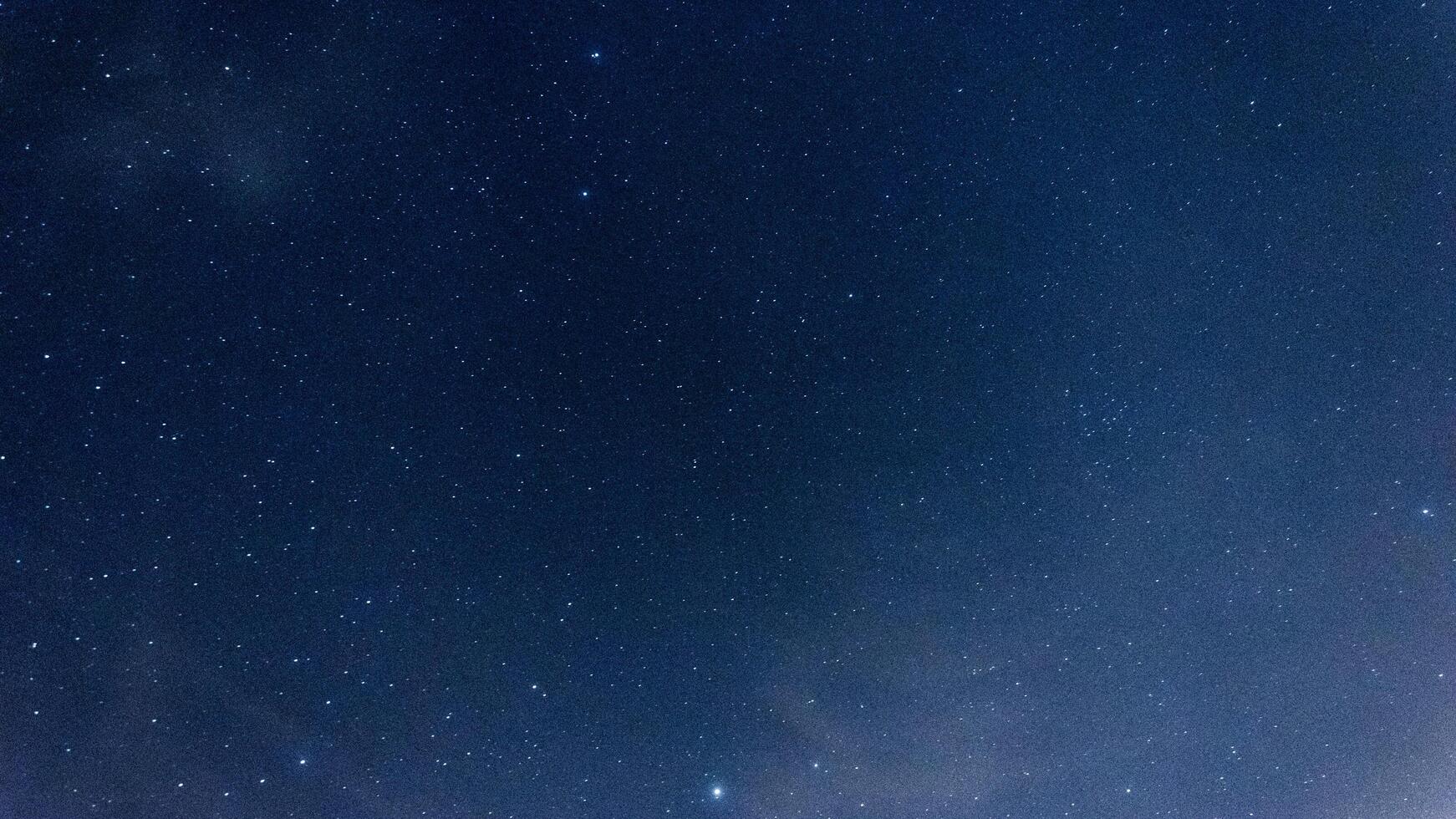stars in the blue sky at night photo