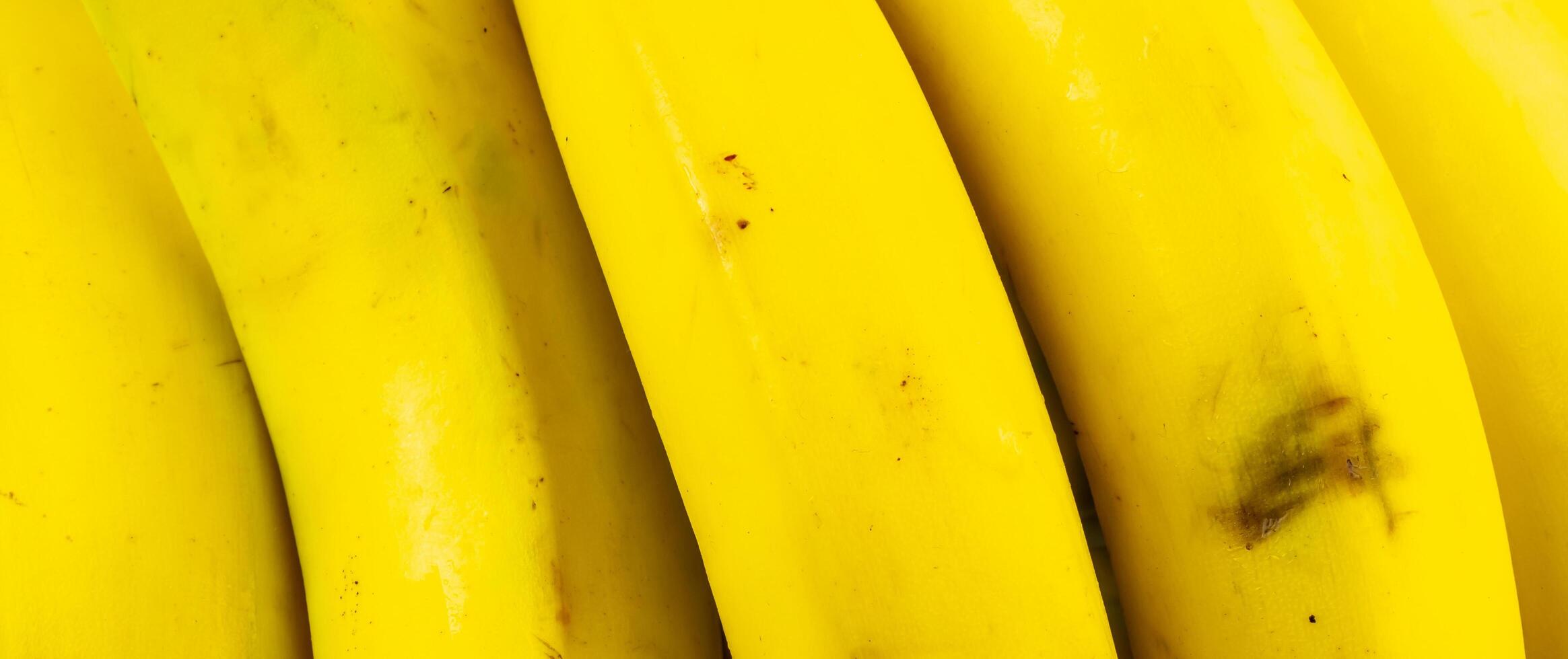 macro photo of yellow bananas. background or textura