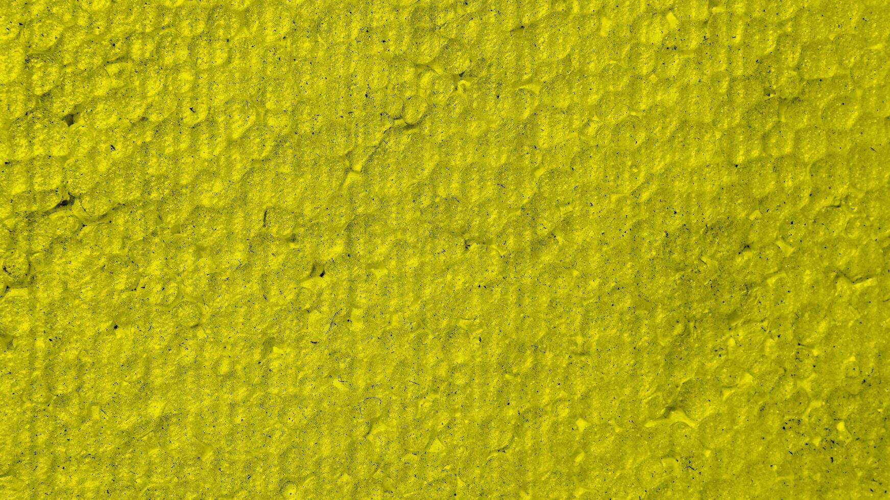 yellow polystyrene with visible details. background or bextura photo