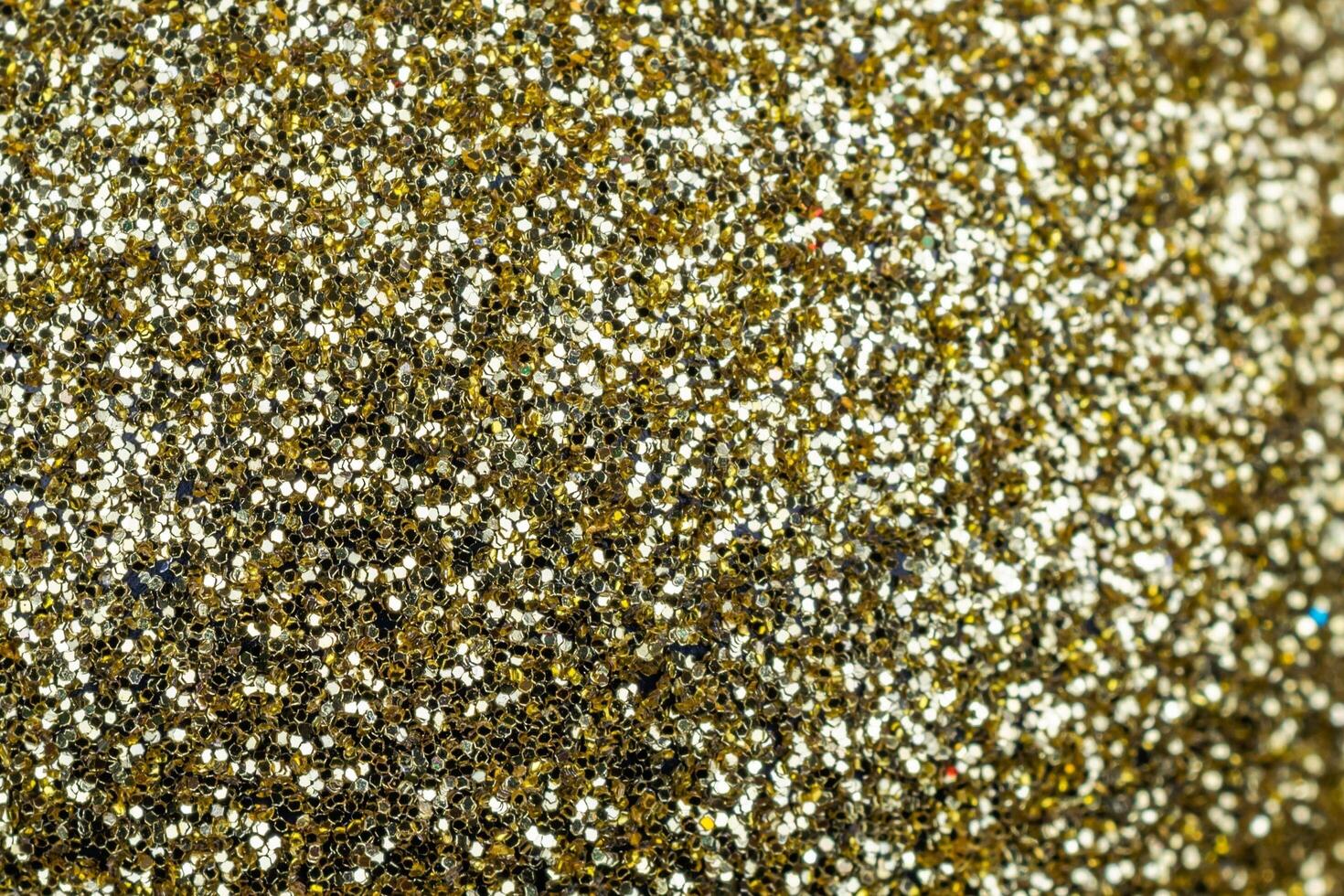 gold glitter with visible details. background or textura photo