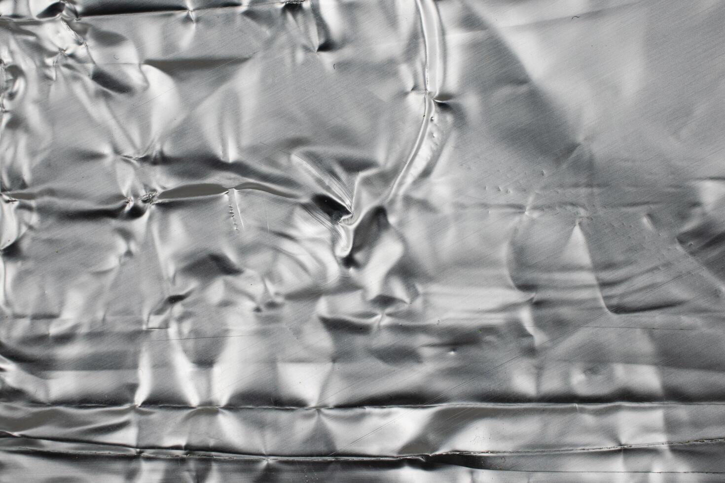 crumpled silver aluminum foil. photo