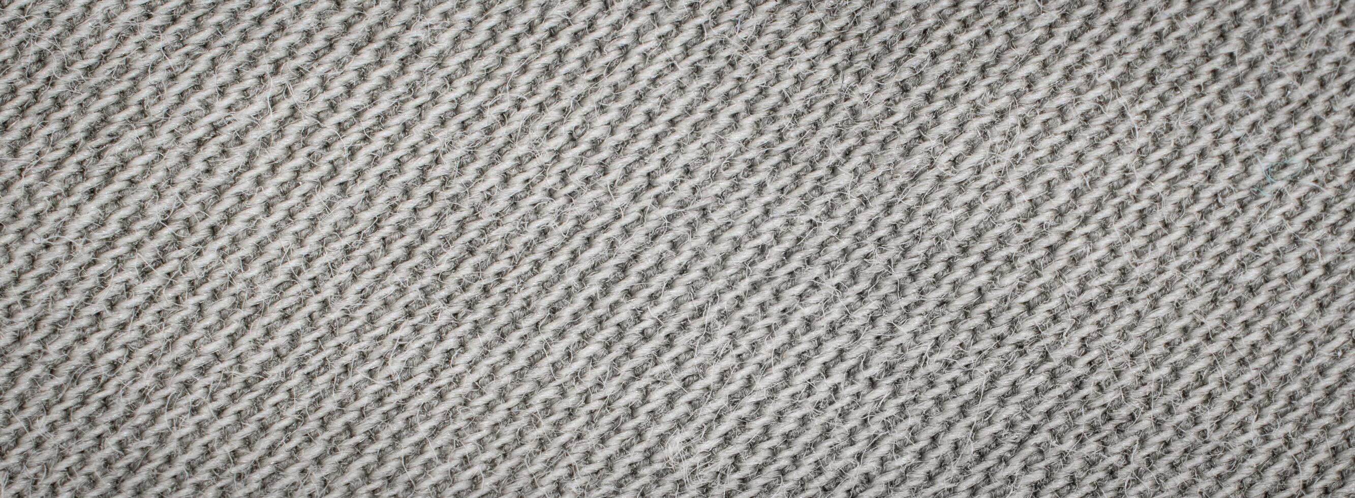 macro photo of gray cotton material. background or textura