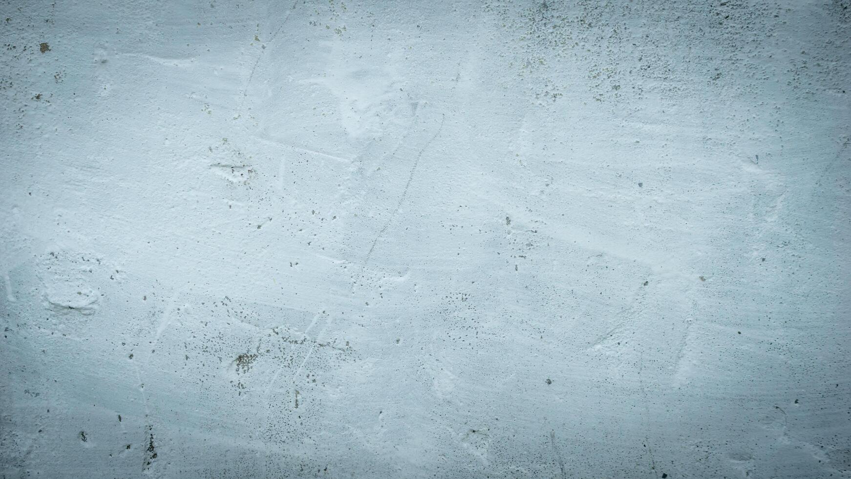 a wall with a visible plaster texture painted blue photo