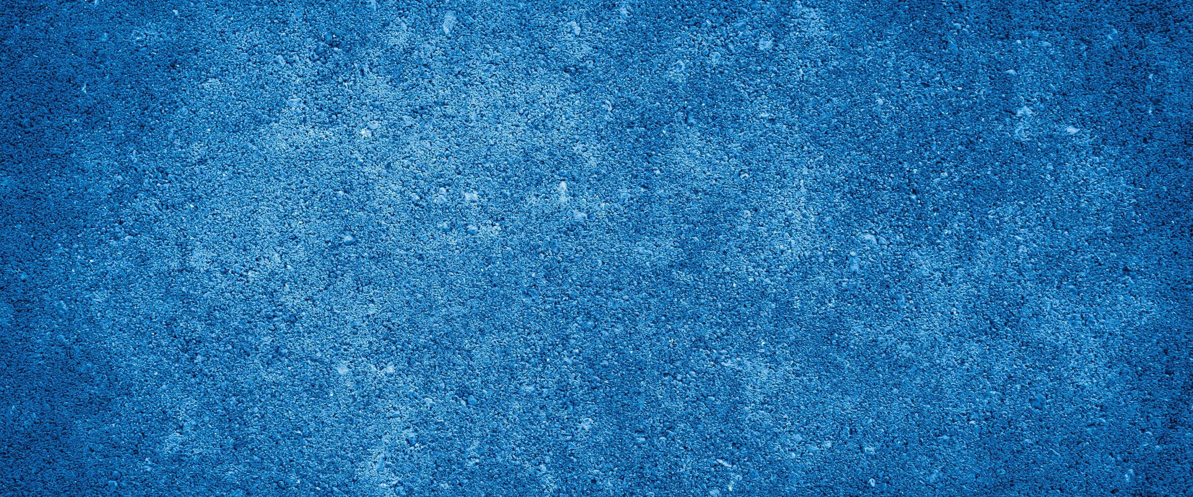 the wall is painted with blue paint with visible details photo
