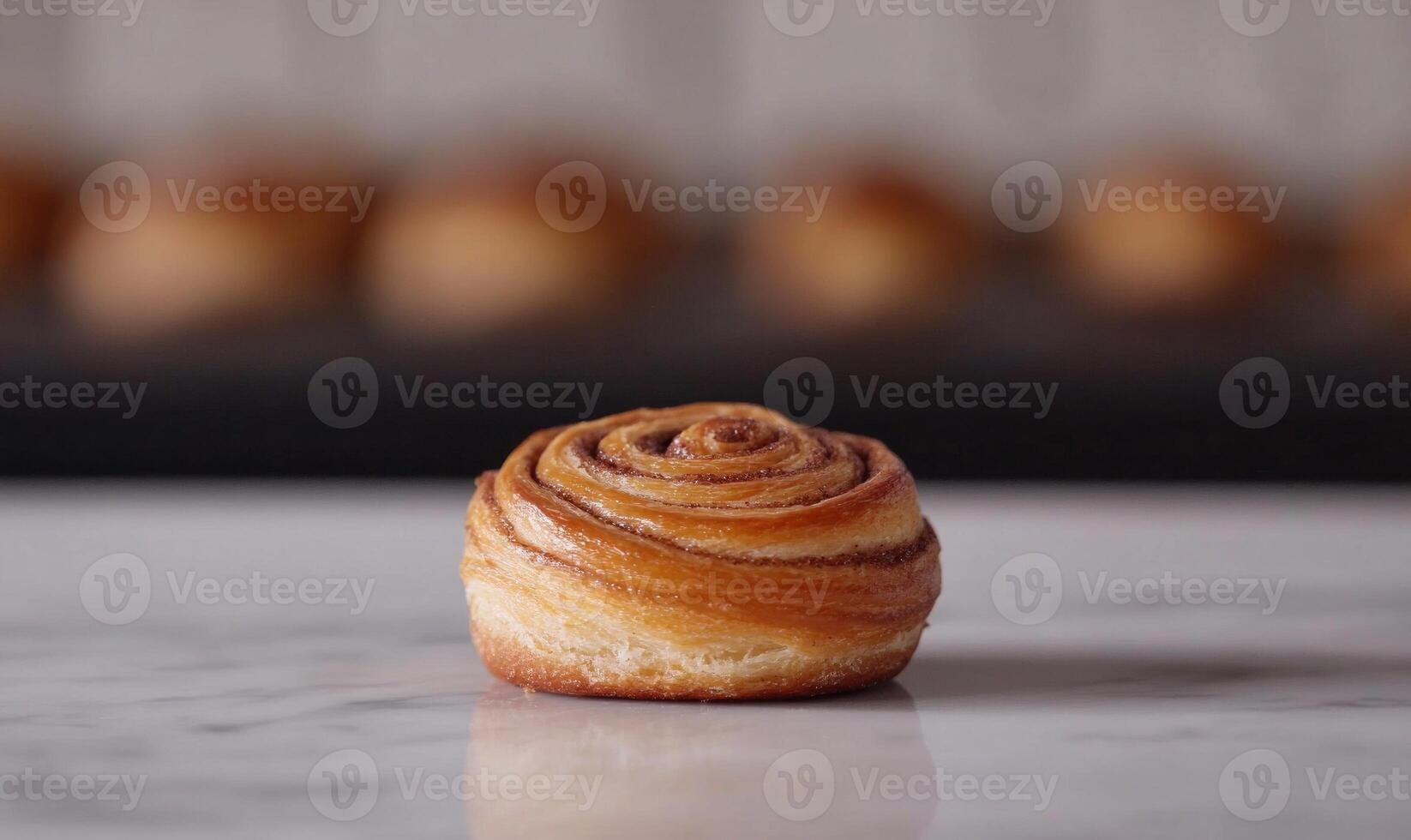 a small pastry on a table with a background of pastry photo