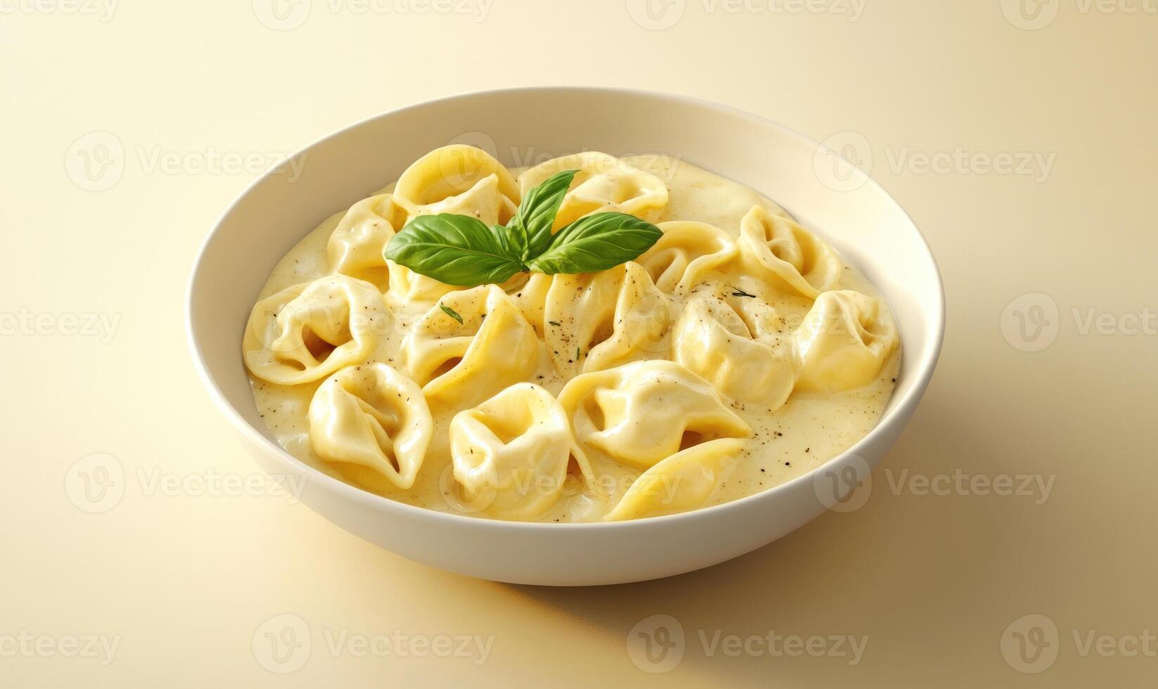 A bowl of pasta with a green leaf on top photo