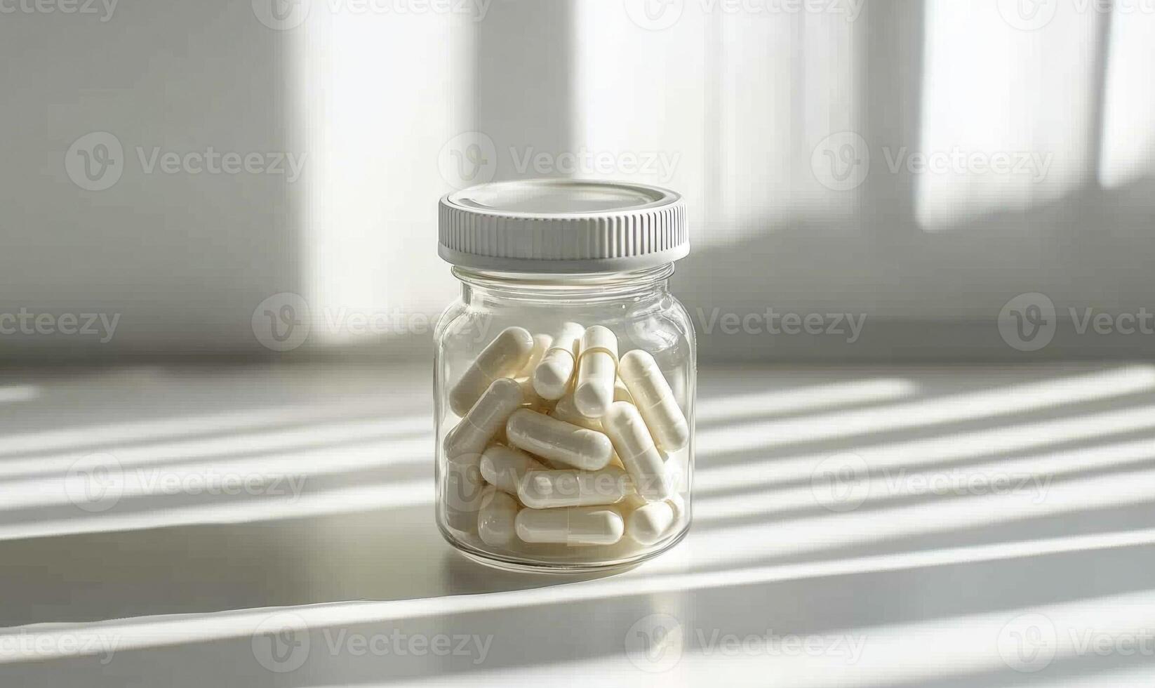 A jar of white pills sits on a table photo