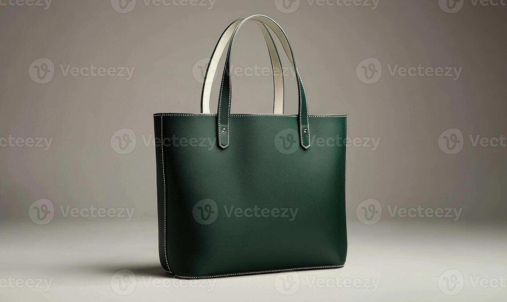 A green purse with a white handle photo