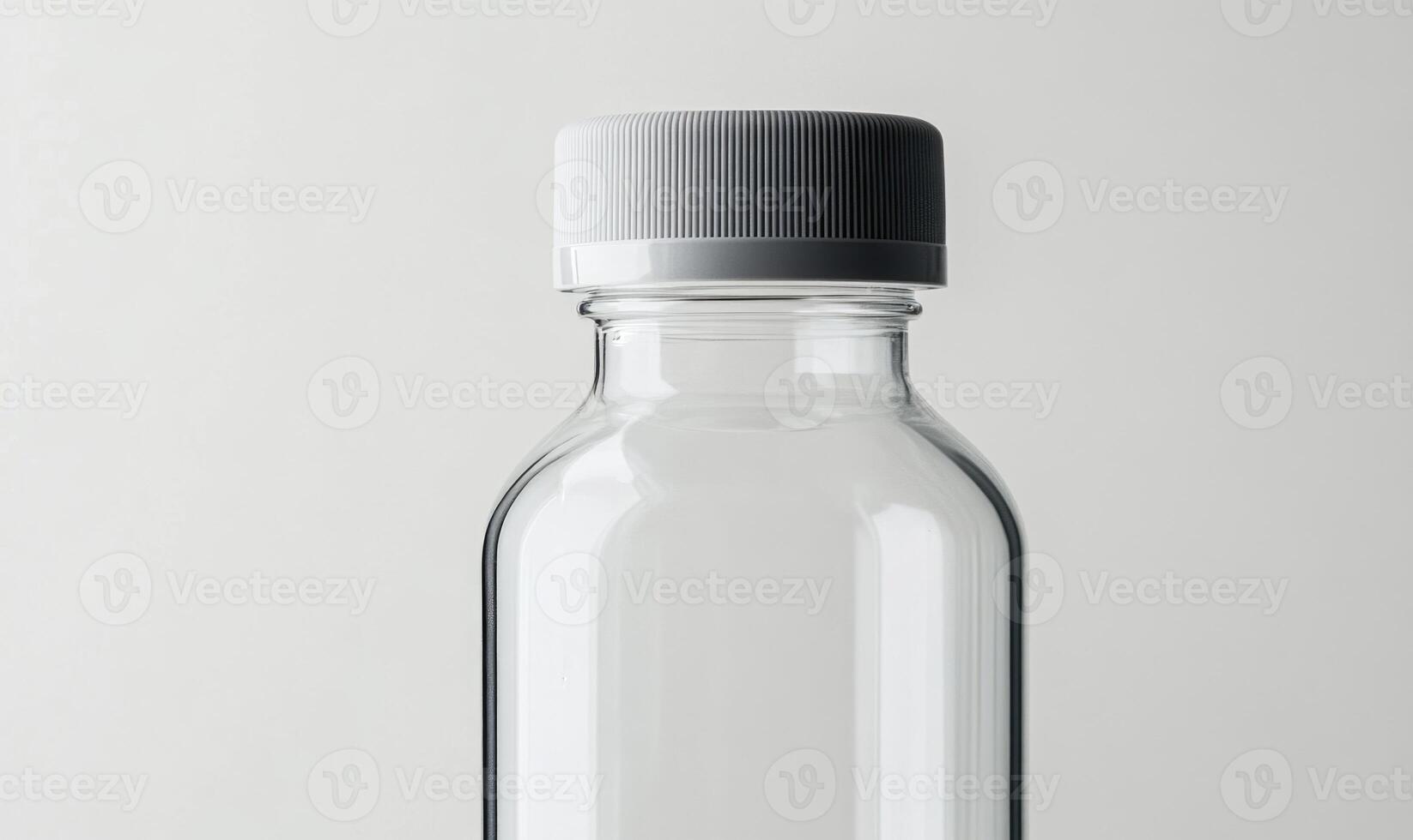 a clear plastic bottle with a white cap photo