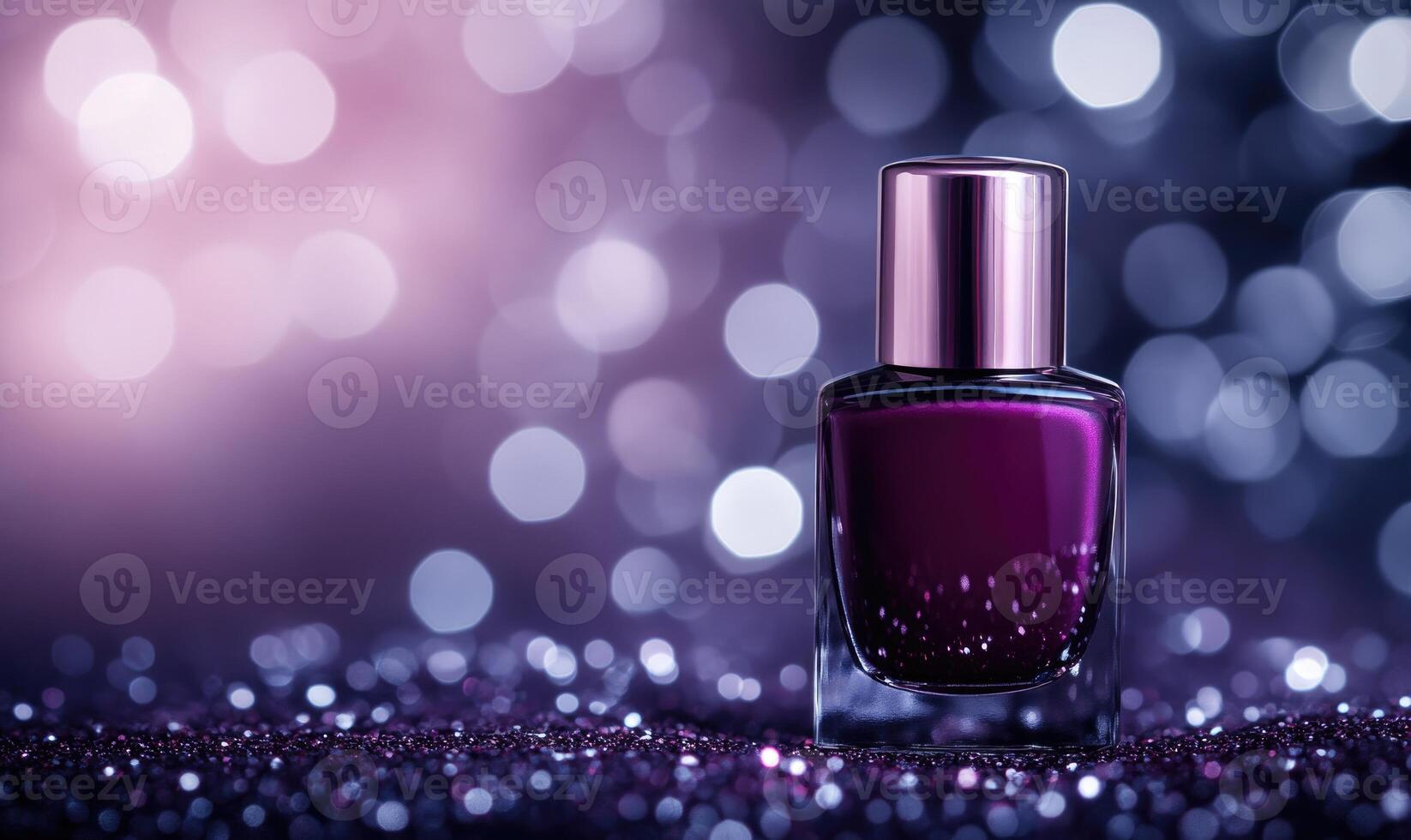 a bottle of purple nail polish on a glittery background photo
