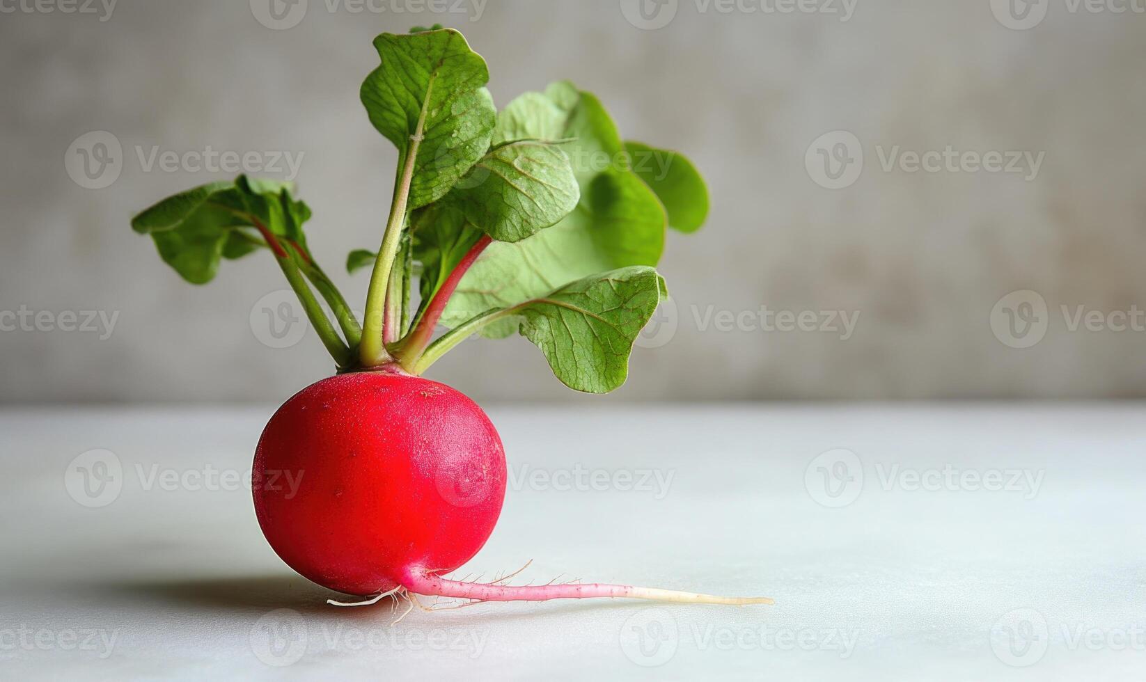 A red radish with a green leaf on top photo
