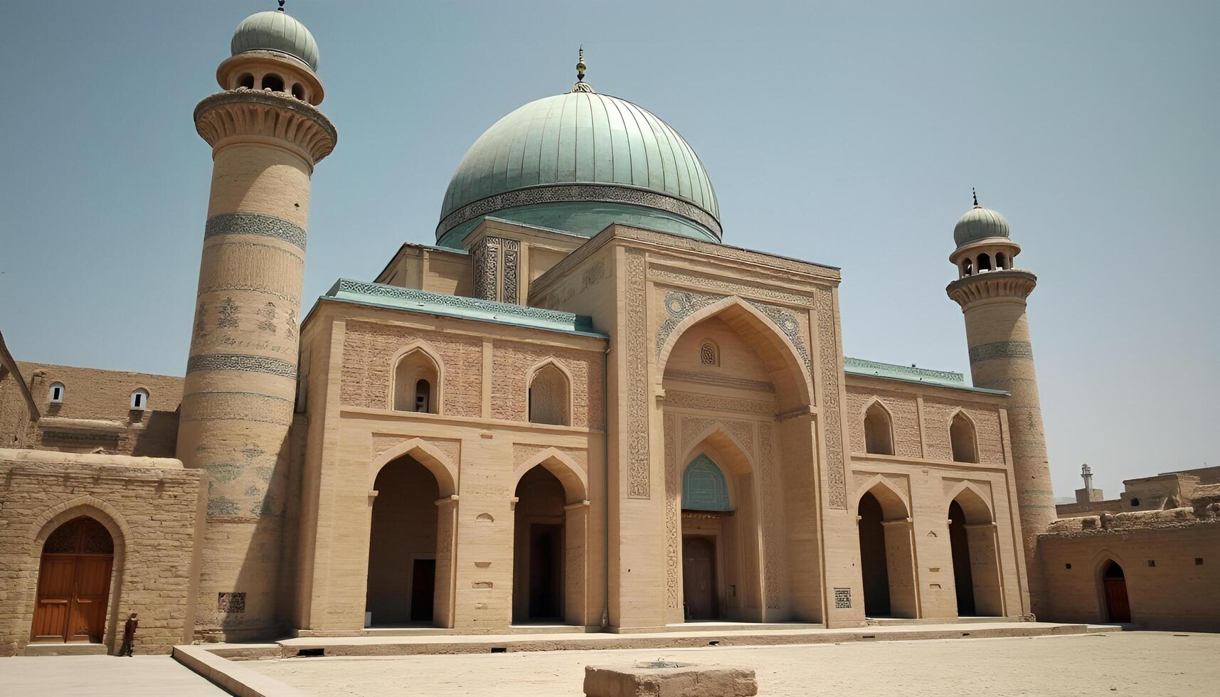The mosque is very large and has two domes photo