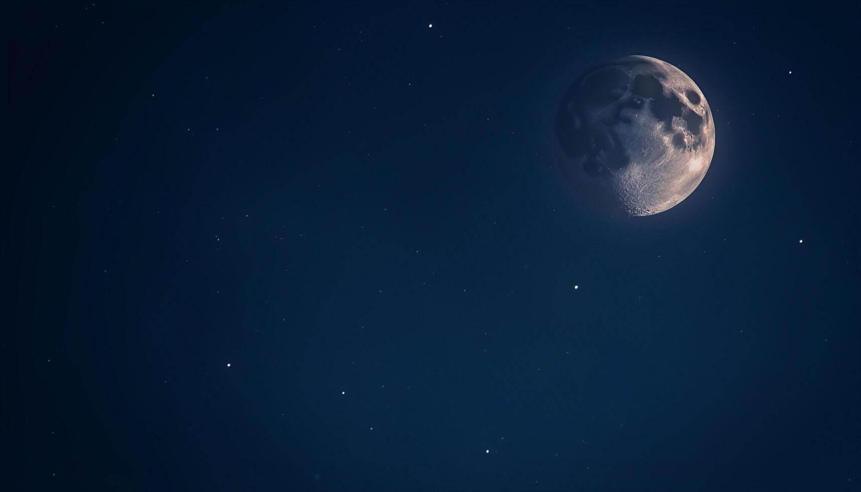 The moon is seen in the night sky photo