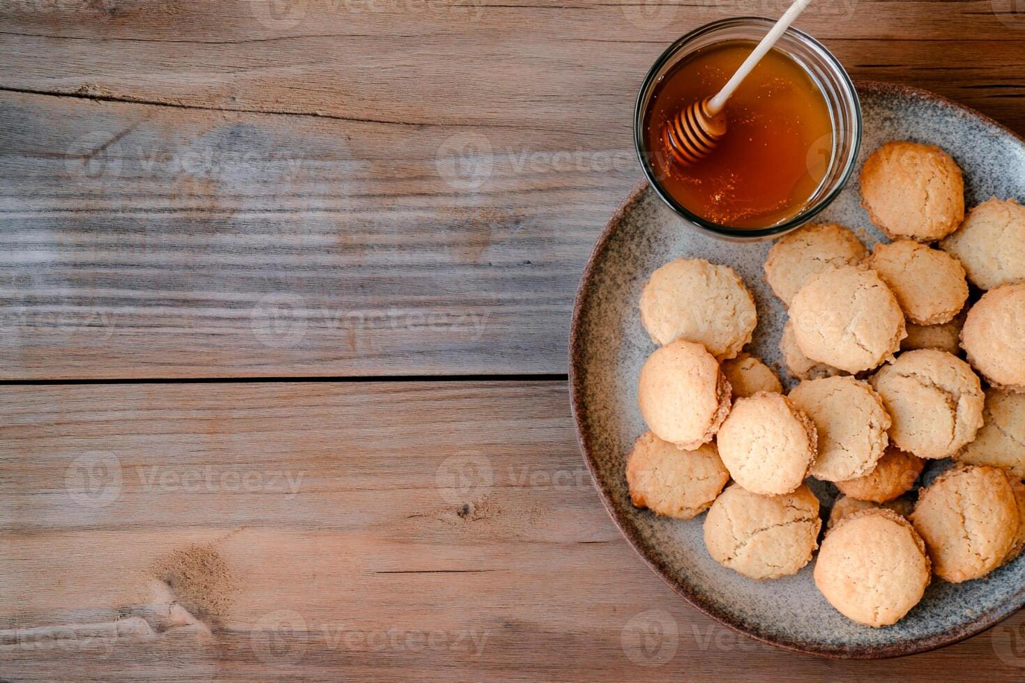 Cookies and honey on a plate photo