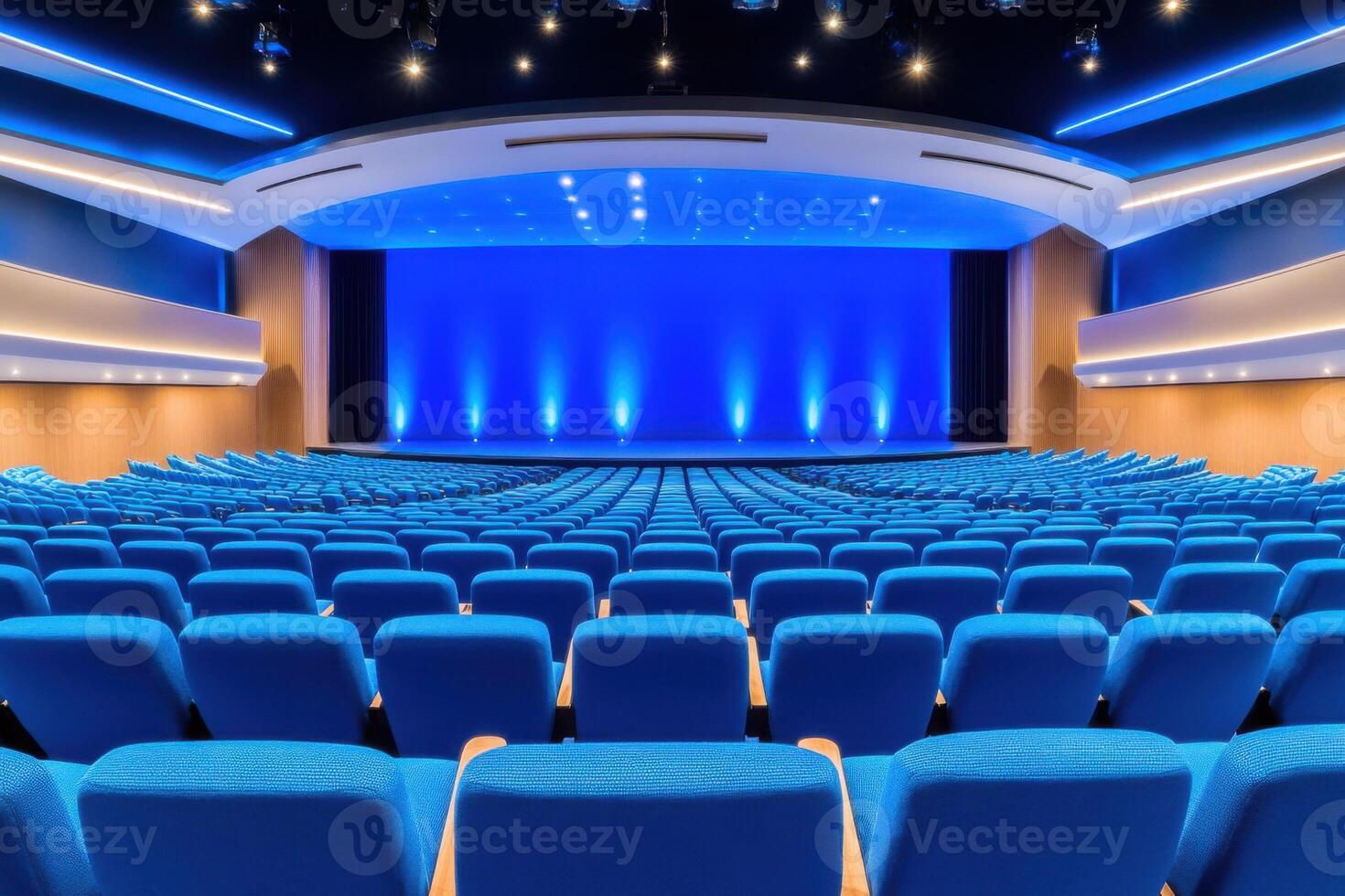Elegant auditorium with blue gradient stage and futuristic lighting set for an immersive event experience photo