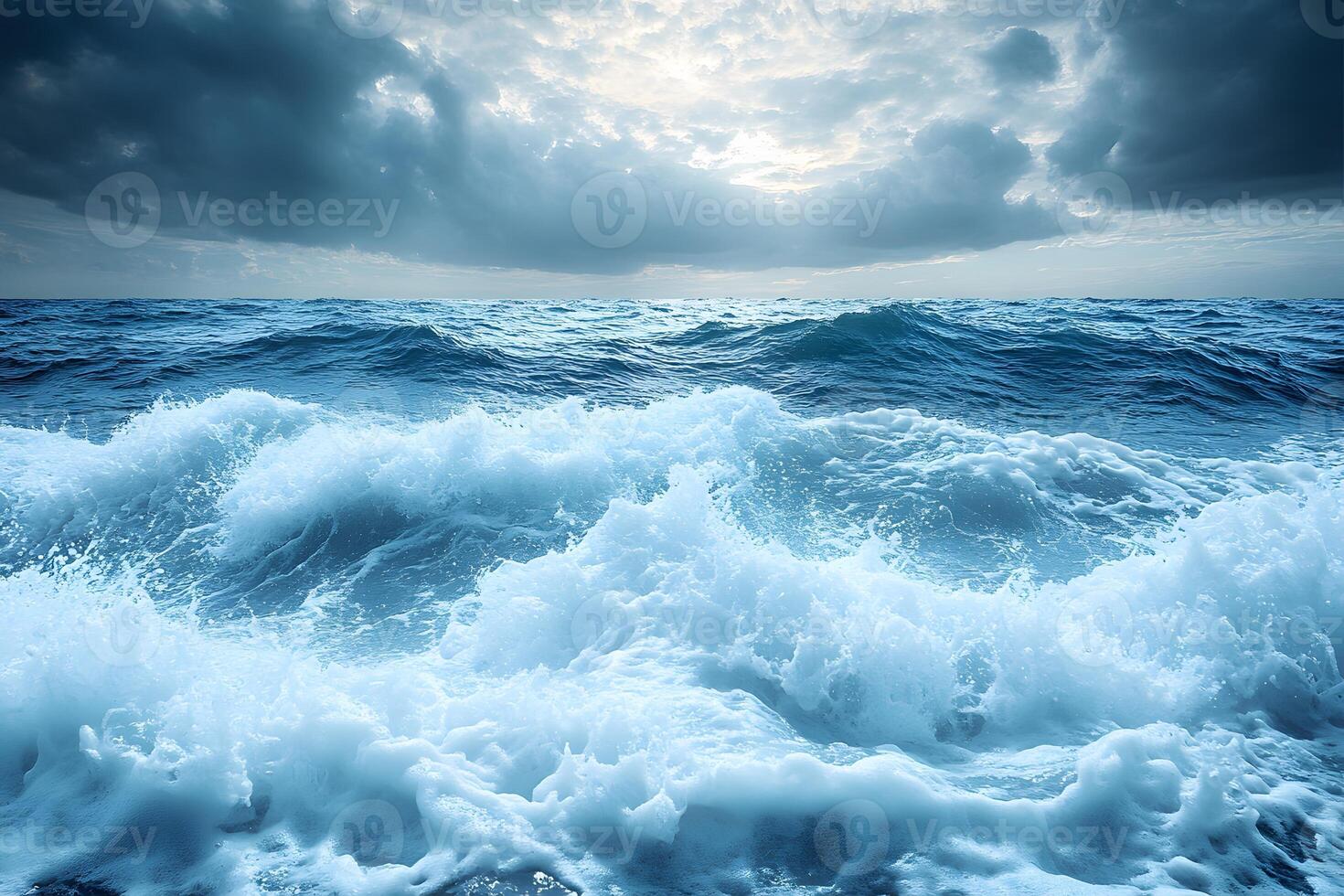 Majestic Ocean Waves Under Dramatic Cloudy Sky Perfect for Nature and Travel Designs photo