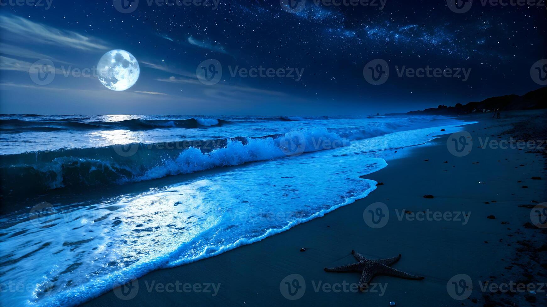 A starfish on the sand in a beach with waves at night with a full moon and a starry sky photo