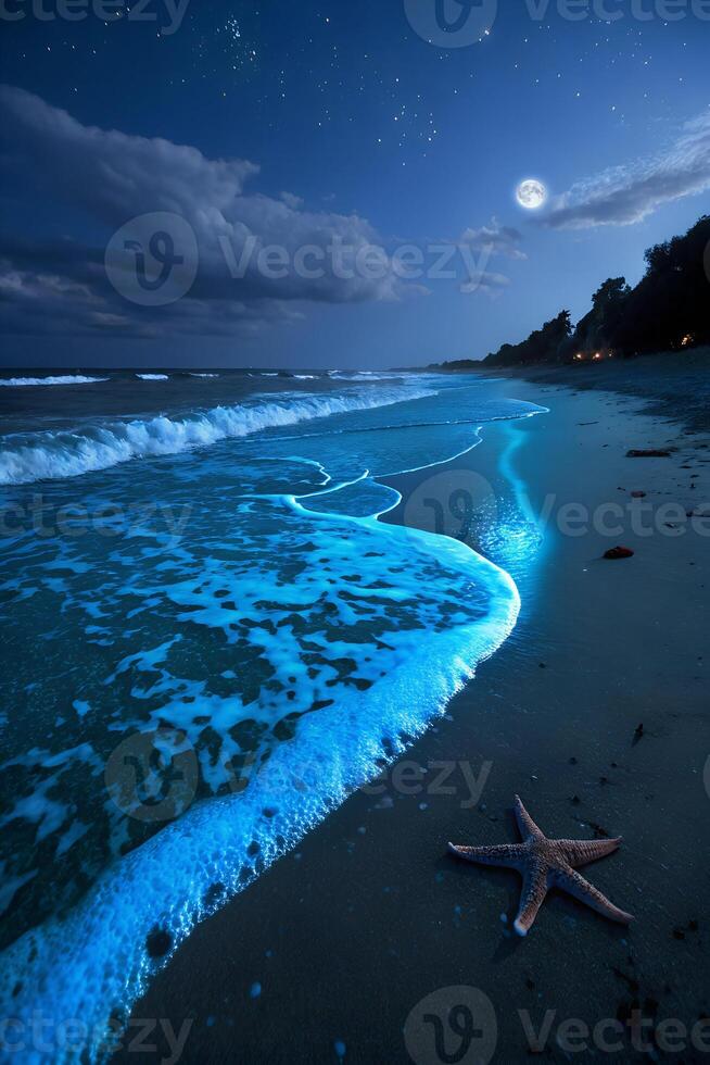 Bioluminescent waves washing onto a sandy beach at night, with a starfish in the foreground and a full moon in the sky photo
