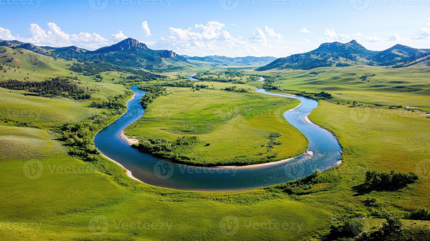 Tranquil landscape of rolling hills with a winding river surrounded by lush greenery under a clear blue sky photo