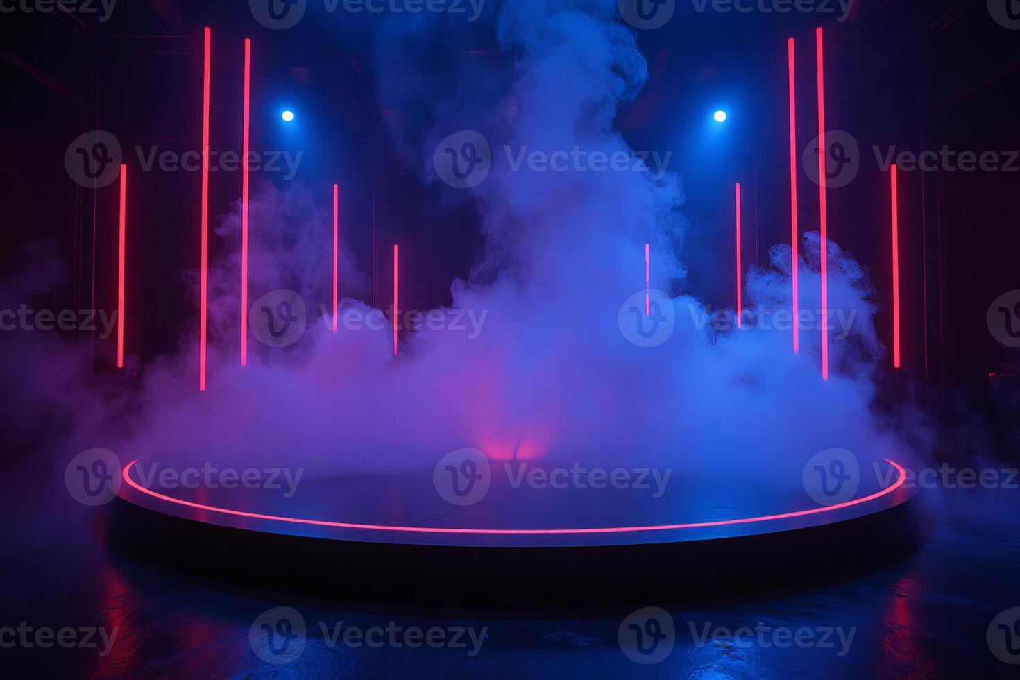 A stage with smoke and neon lights, the background is dark and the stage is illuminated with blue and pink lights photo