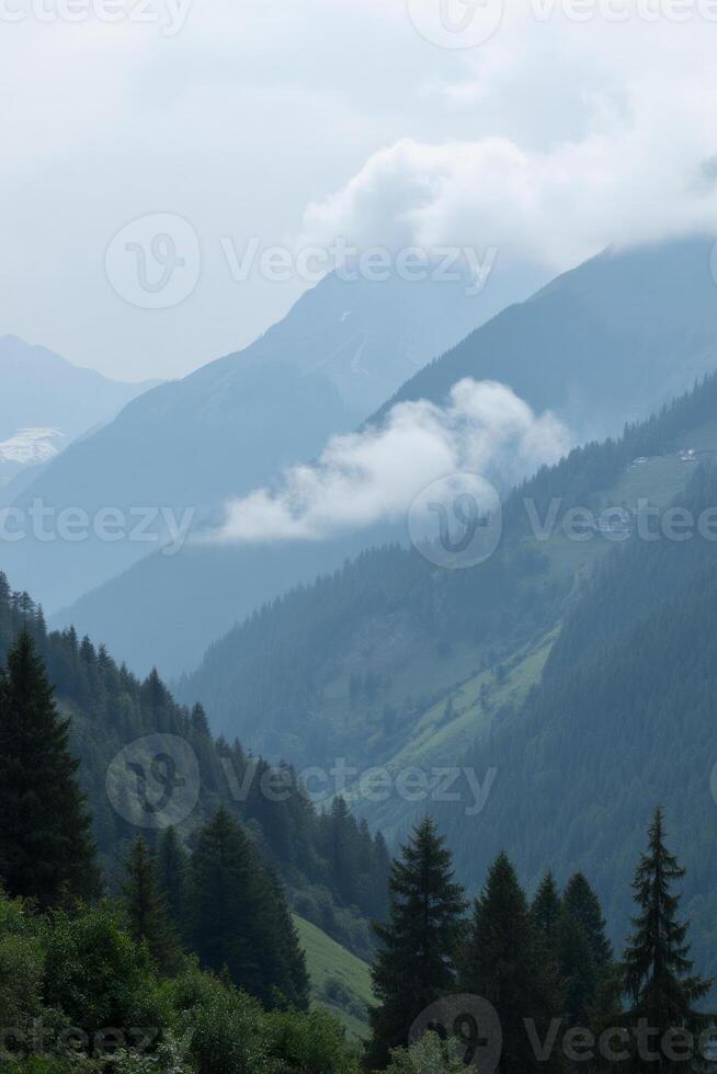 A mountain range covered in green trees and white clouds, the sky is overcast and the mountains are in the distance - scene 02 photo