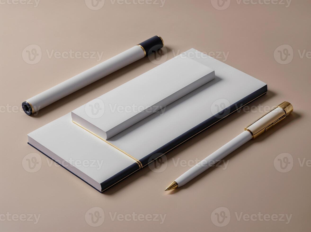 A white and gold pen lays on top of a white notebook photo