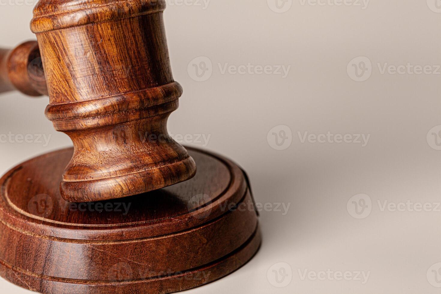 Wooden judges gavel on table close up photo