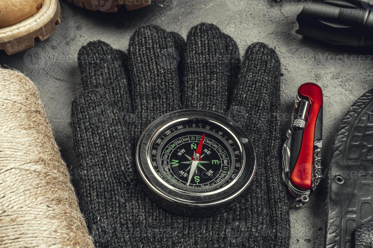 Still life of tools for hiking or travelling with compass photo