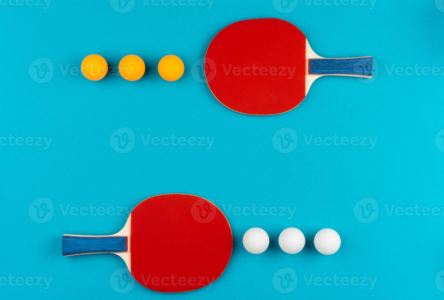 Ping pong racket and ball on blue background photo