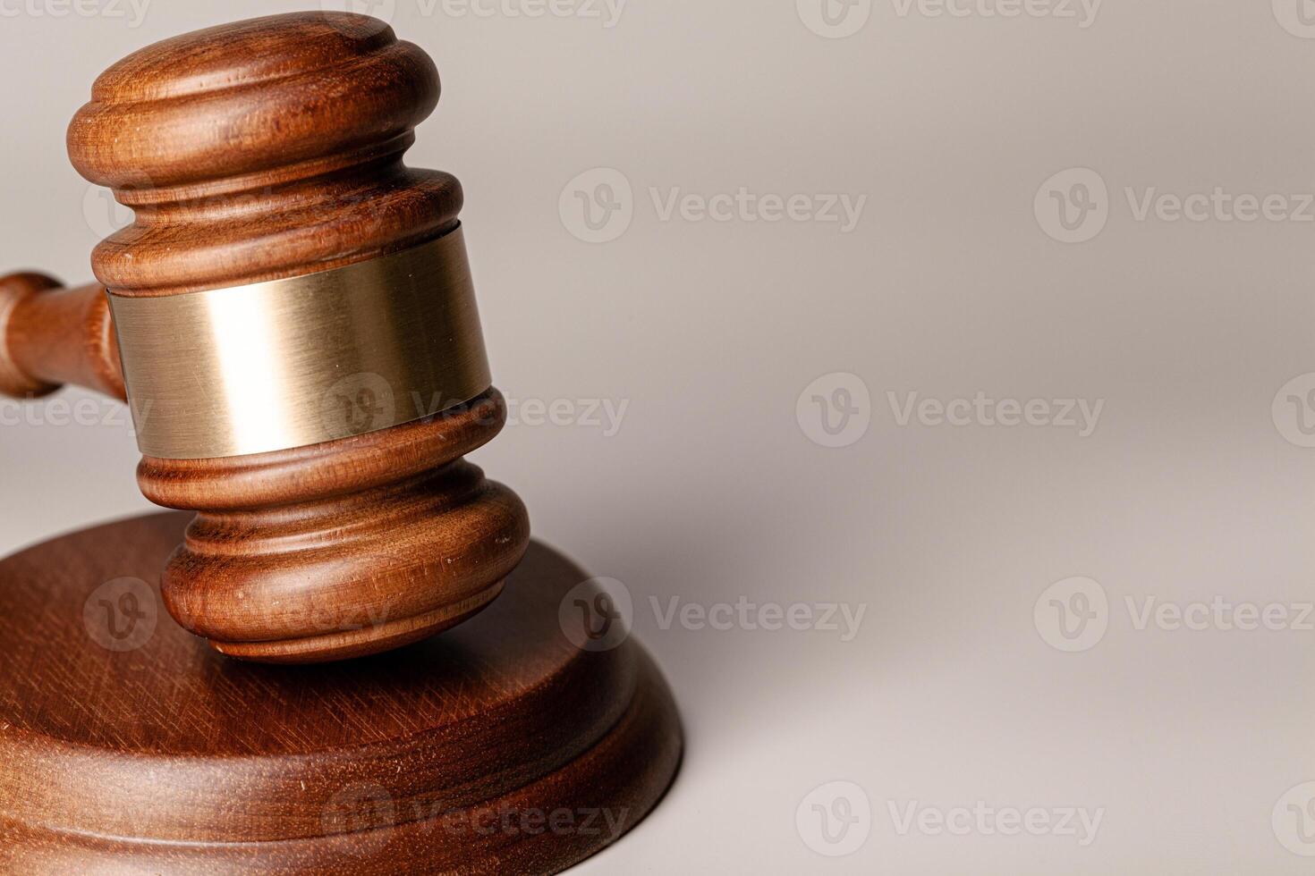 Wooden judges gavel on table close up photo