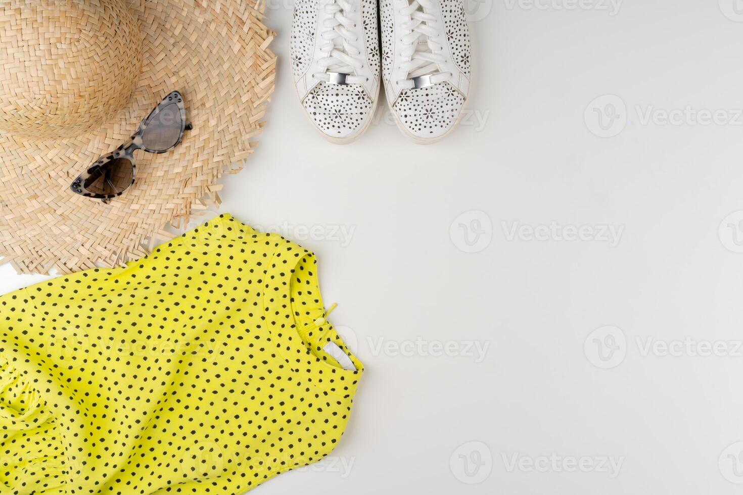 Flat lay of woman summer outfit on white background photo