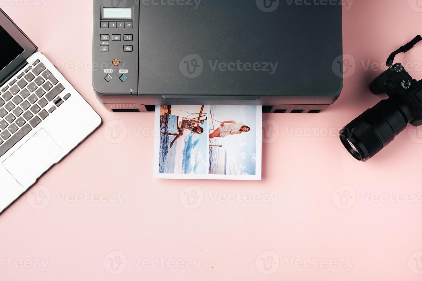 Printer, laptop and camera on table close up. Printing photos